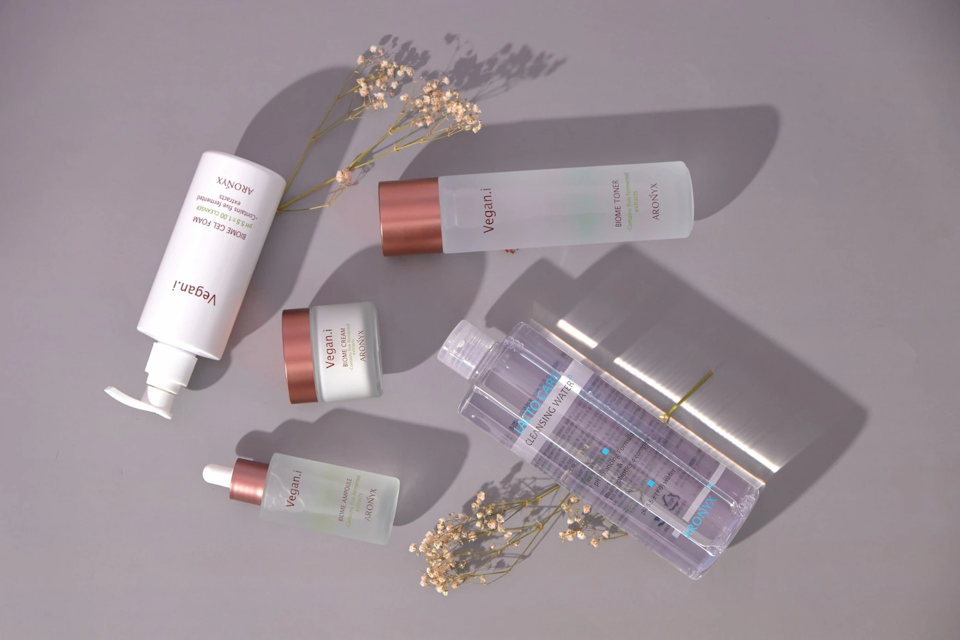 Luxury serum bottles catching soft studio light